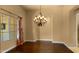 Elegant dining room with hardwood floors and decorative chandelier at 36813 N 109Th Way, Scottsdale, AZ 85262