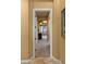 Hallway leading to the main bedroom with natural light and desert views through the large windows at 36813 N 109Th Way, Scottsdale, AZ 85262