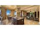 Gourmet kitchen with island and breakfast nook featuring golf course views at 36813 N 109Th Way, Scottsdale, AZ 85262