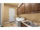 Laundry room featuring white washer and dryer and a utility sink at 36813 N 109Th Way, Scottsdale, AZ 85262