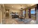 Spacious living room featuring an open floor plan and large windows overlooking a private backyard at 36813 N 109Th Way, Scottsdale, AZ 85262