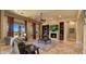 Spacious living room with fireplace, built-in shelving, and large windows showcasing desert landscape at 36813 N 109Th Way, Scottsdale, AZ 85262