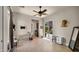 Bright living room with tile floors, ceiling fan, and sliding glass doors leading to an outdoor space at 36813 N 109Th Way, Scottsdale, AZ 85262