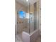 Modern glass-enclosed shower with neutral tile and stylish fixtures, creating a spa-like experience at 36813 N 109Th Way, Scottsdale, AZ 85262