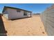Backyard view shows space, block wall, and covered patio at 37168 W Prado St, Maricopa, AZ 85138