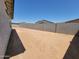 Backyard view showing the spacious lot with block wall at 37168 W Prado St, Maricopa, AZ 85138