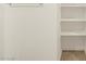 Bright bathroom featuring a built-in shelving unit and modern towel rack at 37168 W Prado St, Maricopa, AZ 85138