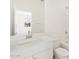 Modern bathroom with a large mirror, vanity and sink and tub with shower at 37168 W Prado St, Maricopa, AZ 85138