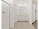 Bright bathroom with double sinks, a shower, and tile flooring at 37168 W Prado St, Maricopa, AZ 85138