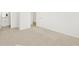Hallway view featuring neutral carpet, white walls and a view to another room at 37168 W Prado St, Maricopa, AZ 85138