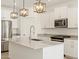 Modern kitchen with granite countertops, stainless steel appliances, and a large island at 37168 W Prado St, Maricopa, AZ 85138