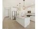Beautiful kitchen with stainless steel appliances, a large island, and modern lighting at 37168 W Prado St, Maricopa, AZ 85138