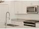 Close up of the gourmet kitchen with stainless appliances and granite counters at 37168 W Prado St, Maricopa, AZ 85138