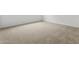 Spacious bedroom with neutral carpeting and freshly painted white walls at 37198 W Vera Cruz Dr, Maricopa, AZ 85138