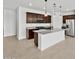 Modern kitchen featuring granite countertops, stainless steel appliances, and a spacious island at 37198 W Vera Cruz Dr, Maricopa, AZ 85138