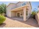 The backyard features a covered patio, desert landscaping, and access to the home's interior at 4010 W Fremont Rd, Phoenix, AZ 85041