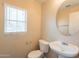 Powder room with single sink vanity and round mirror at 4010 W Fremont Rd, Phoenix, AZ 85041