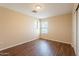 This bedroom features wood floors, neutral walls, and natural light through a window at 4010 W Fremont Rd, Phoenix, AZ 85041