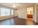 Bright bedroom with wood-look flooring and neutral paint, next to en-suite bathroom at 4010 W Fremont Rd, Phoenix, AZ 85041