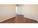 Bedroom featuring wood floors and a view into an adjoining room at 4010 W Fremont Rd, Phoenix, AZ 85041