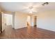 Bedroom with wood floors, ceiling fan, and views to other rooms at 4010 W Fremont Rd, Phoenix, AZ 85041