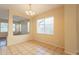 Comfortable dining room featuring tile floors, a modern light fixture, and bright natural light at 4010 W Fremont Rd, Phoenix, AZ 85041