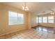 Bright dining area with tile floors and decorative lighting at 4010 W Fremont Rd, Phoenix, AZ 85041