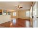 Spacious living room boasts wood floors and ample natural light with an open floor plan at 4010 W Fremont Rd, Phoenix, AZ 85041