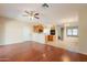 Inviting open floor plan features wood floors that connects the living room and kitchen at 4010 W Fremont Rd, Phoenix, AZ 85041