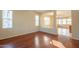 Bright and spacious living room featuring wood floors and natural light from large windows at 4010 W Fremont Rd, Phoenix, AZ 85041