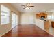 View of living room with wood floors that flows into kitchen area at 4010 W Fremont Rd, Phoenix, AZ 85041