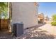 A view of the side yard, showing the AC unit and fence at 4010 W Fremont Rd, Phoenix, AZ 85041