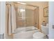 Neutral bathroom with a bathtub, shower and glass enclosure with a framed art work on the wall at 41819 N Anthem Ridge Dr, Phoenix, AZ 85086