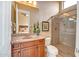 Well-lit bathroom features a single sink vanity and walk-in shower with glass doors at 41819 N Anthem Ridge Dr, Phoenix, AZ 85086