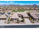Street view of desert home with manicured landscaping, paver driveway and solar panels at 41819 N Anthem Ridge Dr, Phoenix, AZ 85086