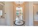 Grand foyer with decorative tile inlay, an archway, chandelier, and views to the living room at 41819 N Anthem Ridge Dr, Phoenix, AZ 85086