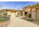 Well-maintained home featuring desert landscaping, stone accents, and a spacious driveway at 41819 N Anthem Ridge Dr, Phoenix, AZ 85086