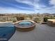 Inviting outdoor hot tub with desert landscaping and picturesque mountain views, perfect for relaxation at 41819 N Anthem Ridge Dr, Phoenix, AZ 85086