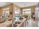 Bright kitchen featuring a large island with a sink and a view of the pool and mountains at 41819 N Anthem Ridge Dr, Phoenix, AZ 85086
