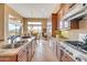 Open concept kitchen and dining area with stainless appliances, an island, and mountain views at 41819 N Anthem Ridge Dr, Phoenix, AZ 85086