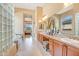Spacious main bathroom with double sinks, granite countertops, and tile flooring at 41819 N Anthem Ridge Dr, Phoenix, AZ 85086