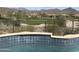 Close-up view of serene swimming pool with golf course view, perfect for relaxation at 41819 N Anthem Ridge Dr, Phoenix, AZ 85086