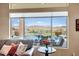 An inviting view of the backyard pool and spa area from the comfort of the living room at 41819 N Anthem Ridge Dr, Phoenix, AZ 85086