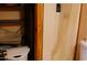 A compact bathroom interior featuring essential fixtures and a shower with a partial curtain at 4550 W Cinnabar Ave, Glendale, AZ 85302