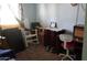 A room with mixed furnishings, including a rocking chair, desk, and dresser, reflecting a cozy, lived-in atmosphere at 4550 W Cinnabar Ave, Glendale, AZ 85302
