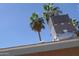 Rooftop AC unit with palm trees in the background under clear blue sky at 4550 W Cinnabar Ave, Glendale, AZ 85302