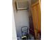 A cluttered storage area with an air conditioner and tool box, showcasing the home's storage capabilities at 4550 W Cinnabar Ave, Glendale, AZ 85302