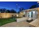 The spacious yard includes a putting green, fire pit, hot tub, outdoor seating, and string lights at 4714 N Miller Rd, Scottsdale, AZ 85251