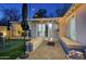 Cozy backyard features a putting green, a modern fire pit, and a covered hot tub for relaxation at 4714 N Miller Rd, Scottsdale, AZ 85251