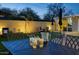 Relaxing backyard features a putting green, outdoor seating, and covered hot tub area perfect for entertaining at 4714 N Miller Rd, Scottsdale, AZ 85251